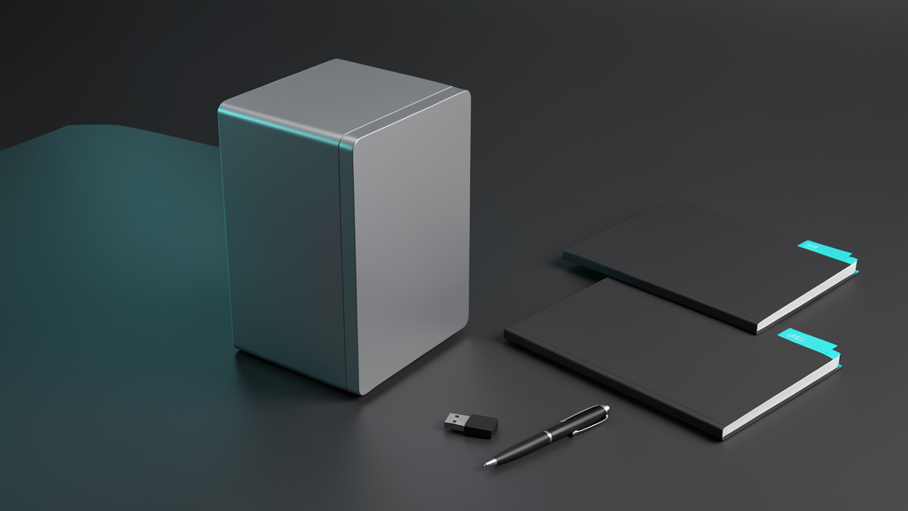 A compact local computer beside workflow folios and operating tools